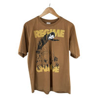 Regime Change Graphic Tee — Toppling Statue Print, Camel