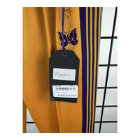 Needles Narrow Track Pant — Yellow Gold / Purple Butterfly Embroidery